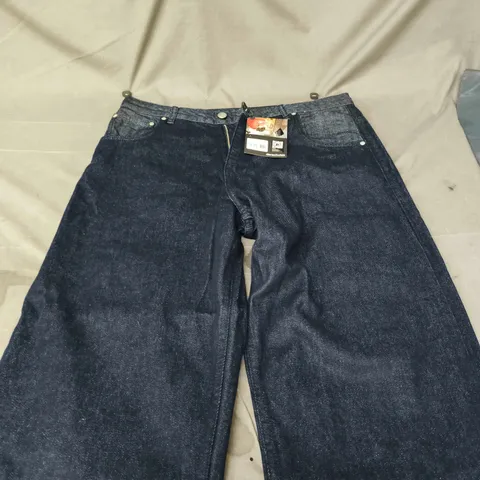 DERSCHUTZ INDIGO RAW DENIM JEANS – UK 34 WITH GEISHA EMBROIDERY ON BACK POCKETS