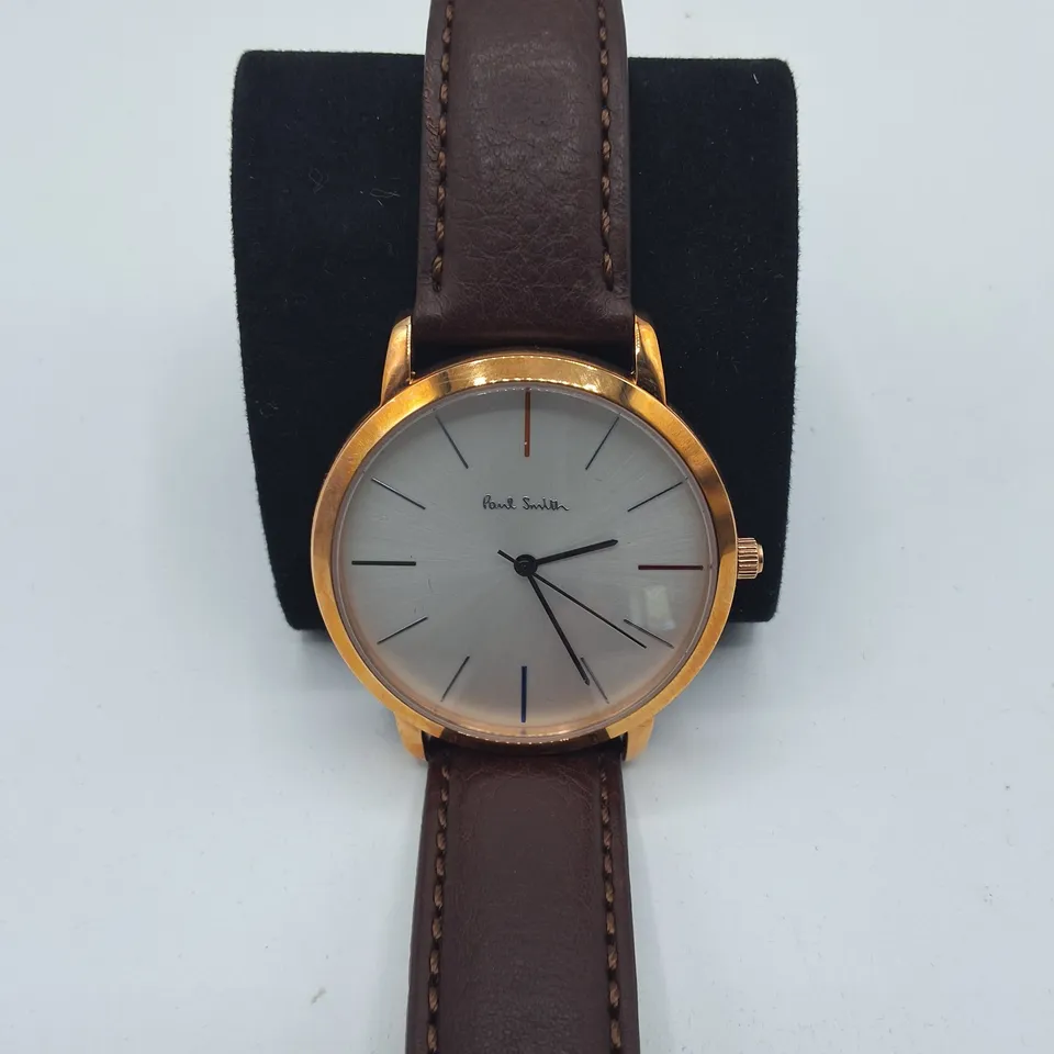 BOXED PAUL SMITH STAINLESS STEEL WATCH WITH JAPANESE MOVEMENT AND BROWN LEATHER STRAP