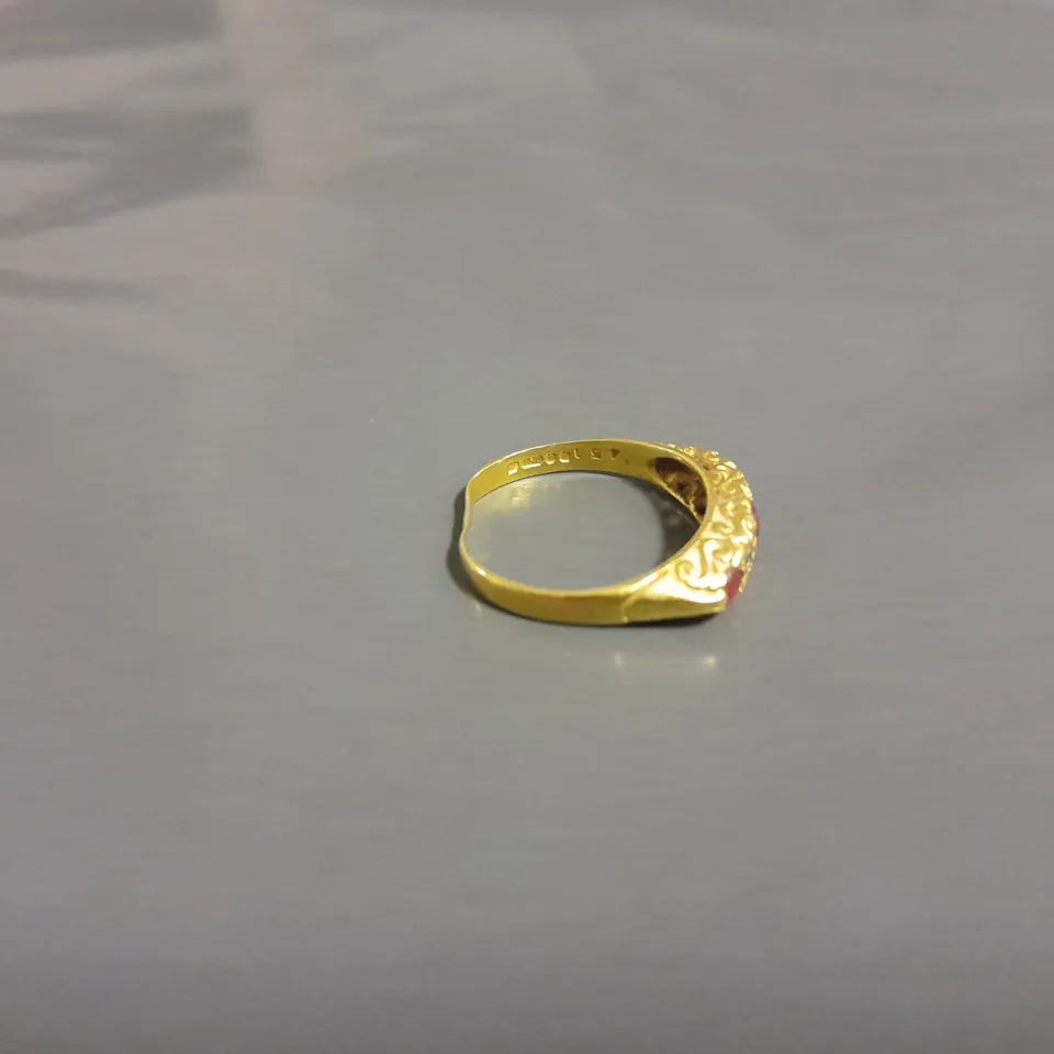 GOLD RING WITH 5 SET STONES 