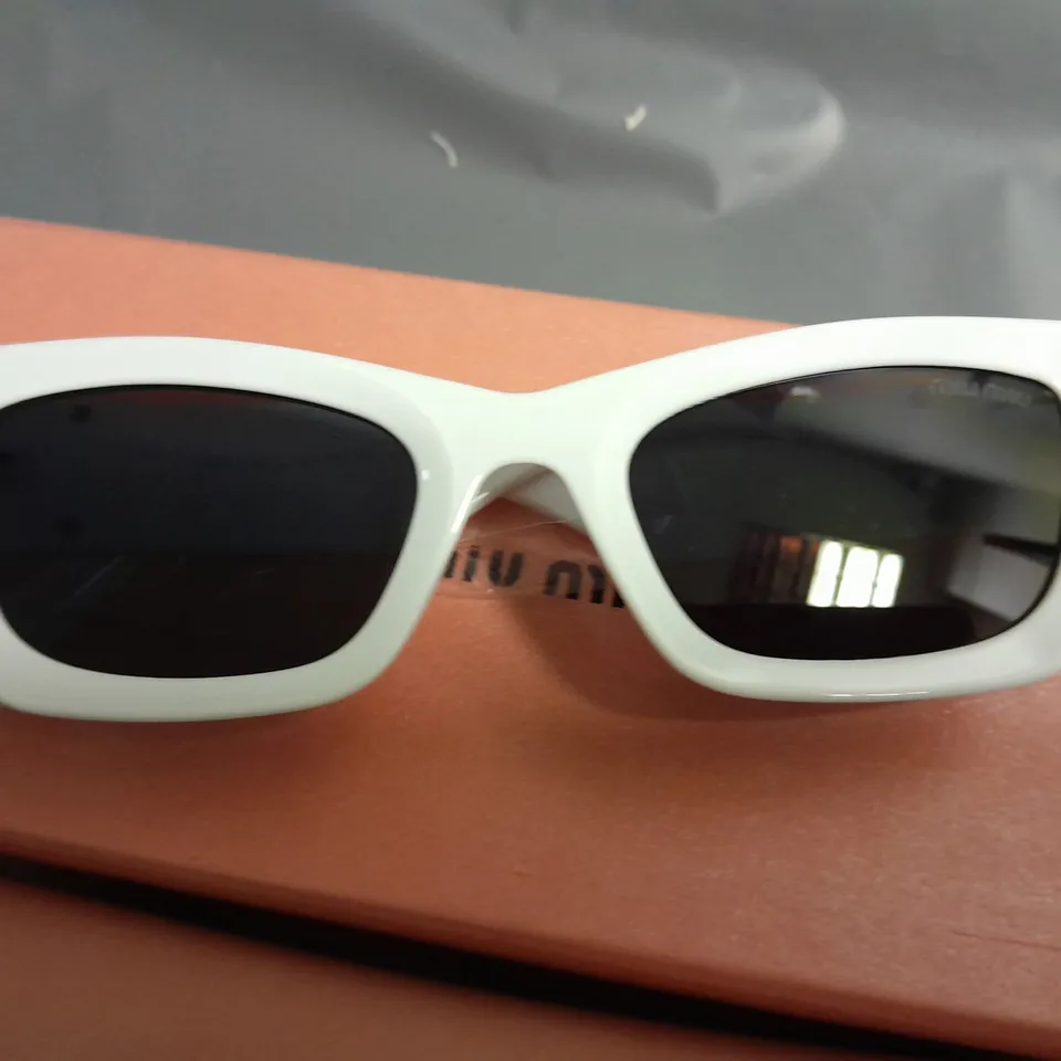 BOXED PAIR OF MIU MIU WHITE CHUNKY FRAMED GLASSES