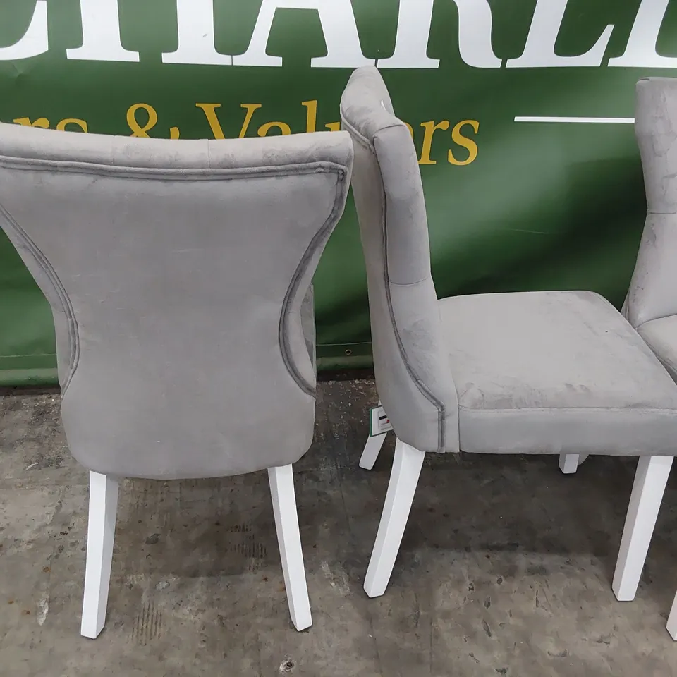 SET OF FOUR UPHOLSTERED DINING CHAIRS BUTTONED BACKS ON WHITE LEGS