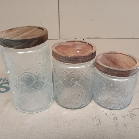 SET OF 3 EMBOSSED GLASS STORAGE JARS WITH WOODEN LIDS