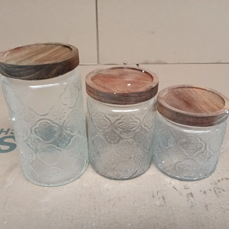 SET OF 3 EMBOSSED GLASS STORAGE JARS WITH WOODEN LIDS