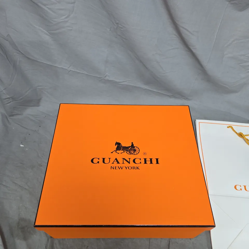 GUANCHI NEW YORK HANDBAG – MONOGRAM CANVAS WITH BROWN LEATHER TRIM