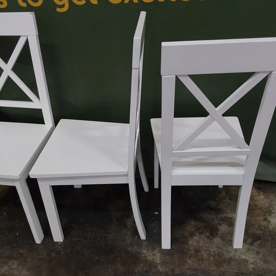 SET OF SIX WHITE PAINTED WOODEN X BACK DINING CHAIRS 