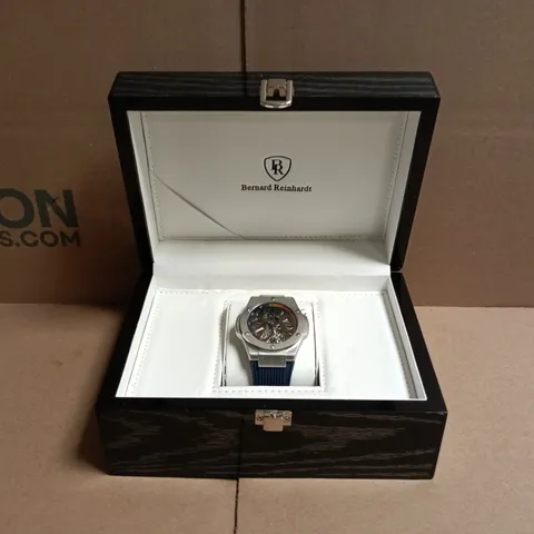 BOXED BERNARD REINHARDT SKELETON WATCH – STAINLESS STEEL CASE, BLUE RUBBER STRAP