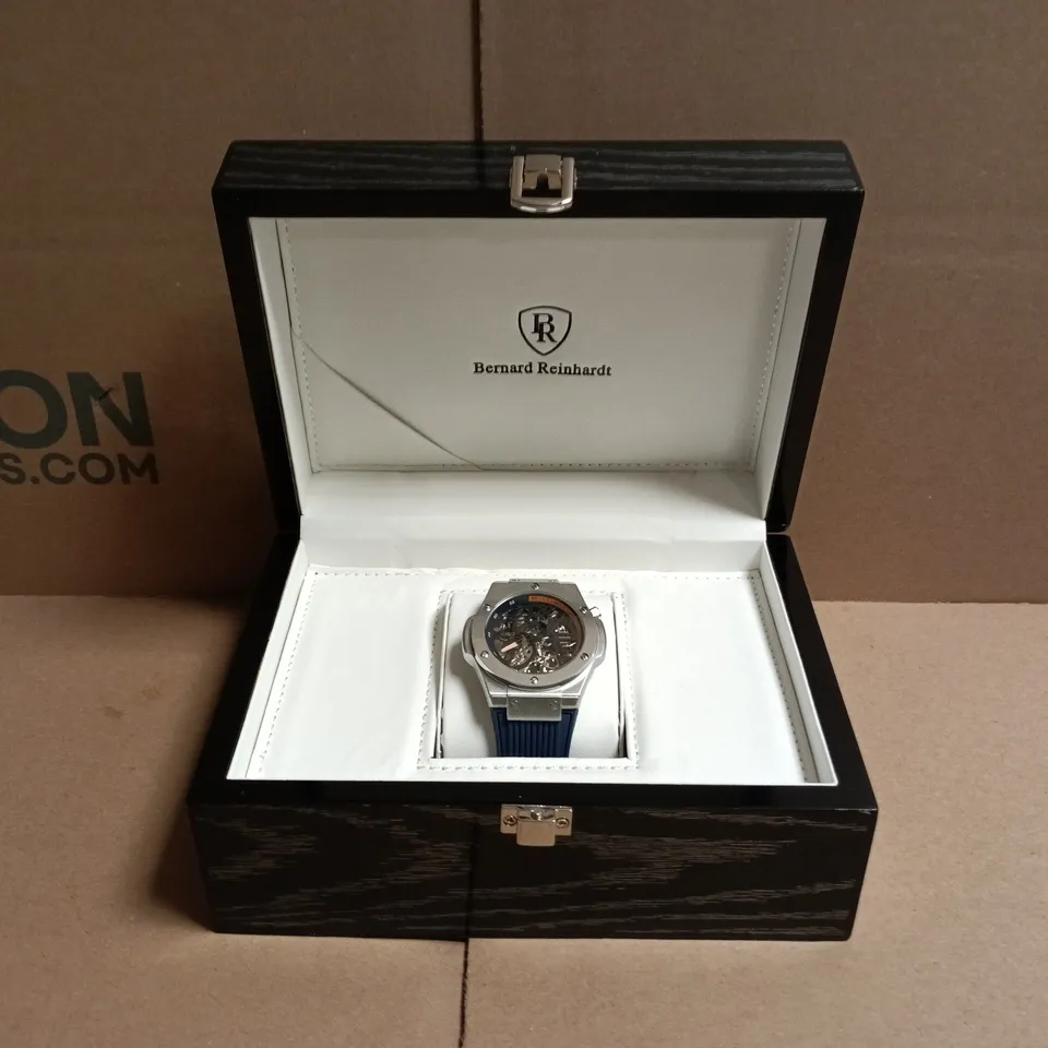 BOXED BERNARD REINHARDT SKELETON WATCH – STAINLESS STEEL CASE, BLUE RUBBER STRAP