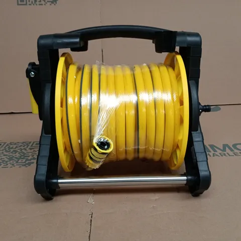 YELLOW GARDEN HOSE REEL ON PORTABLE STAND BOXED