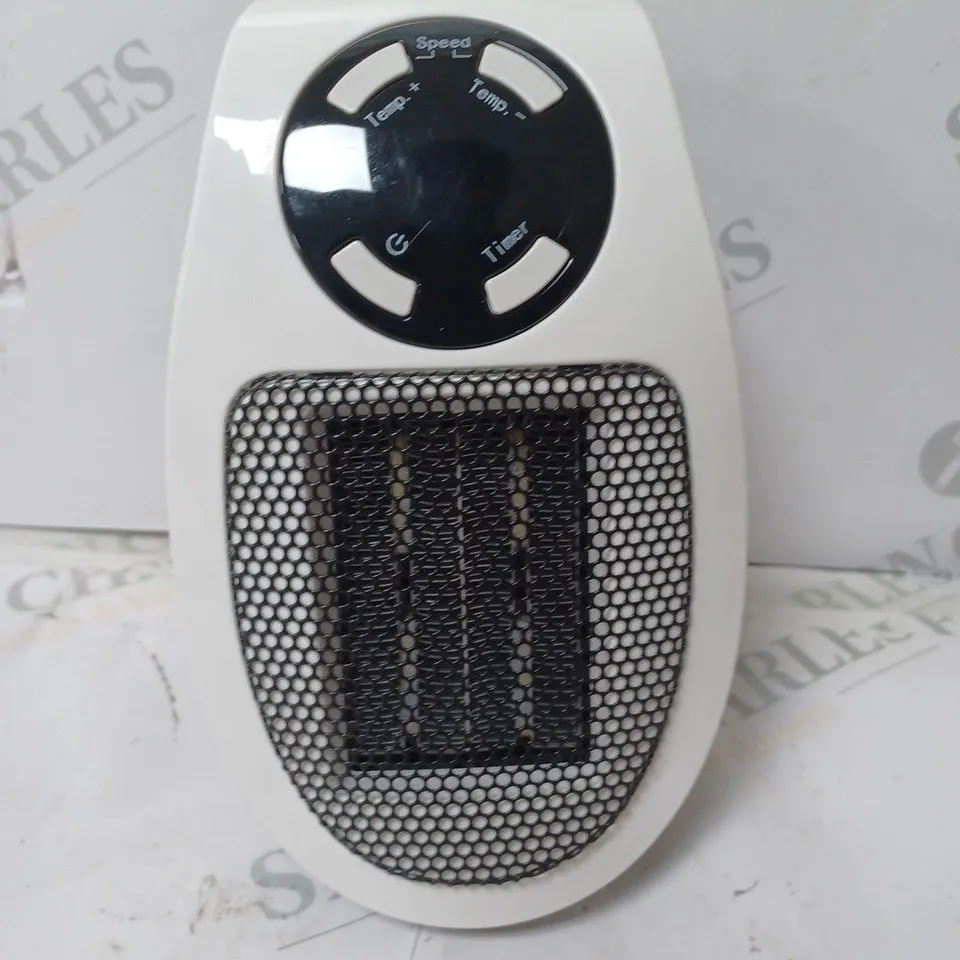 WARM HOME CERAMIC PLUG IN HEATER 