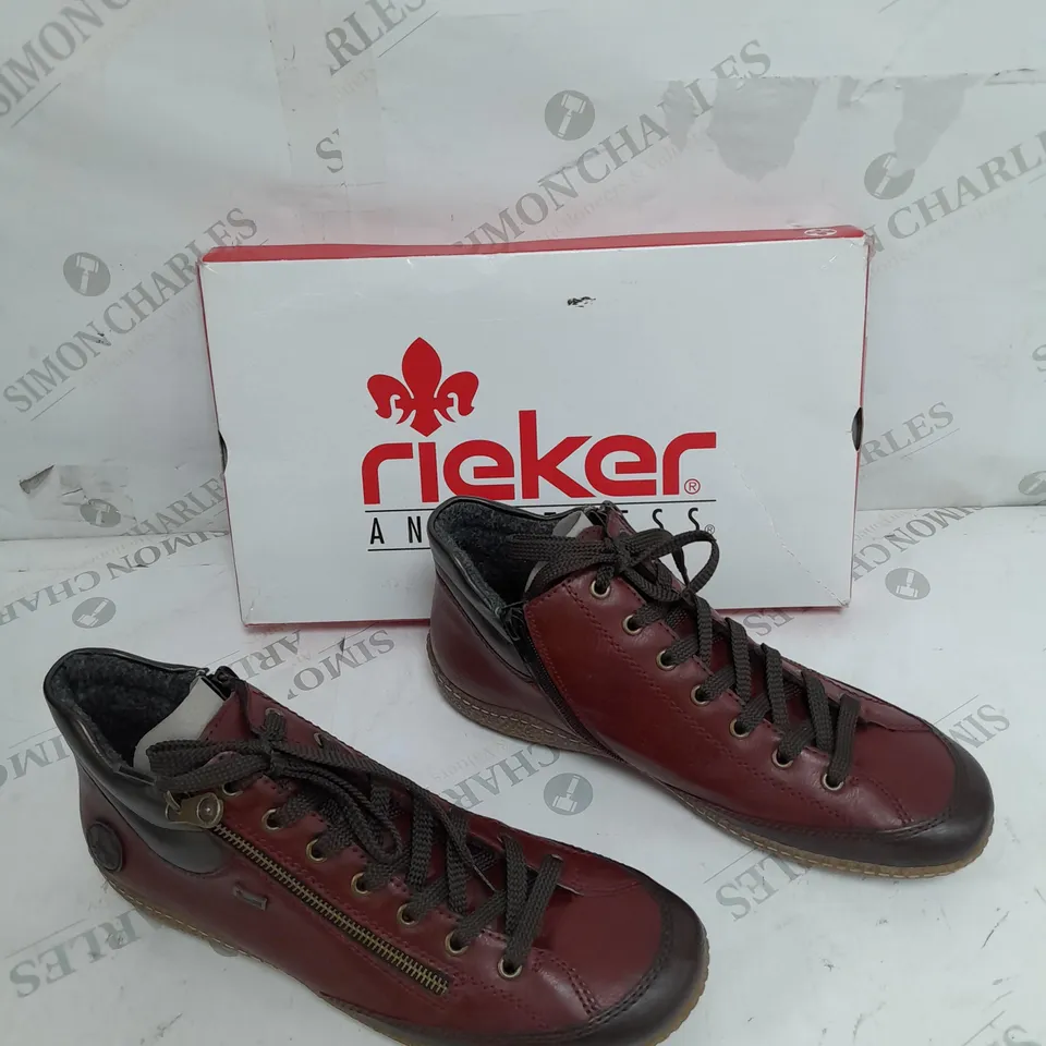 BOXED PAIR OF RIEKER SIDE ZIP WATER RESISTANT BOOTS IN BURGUNDY SIZE 8