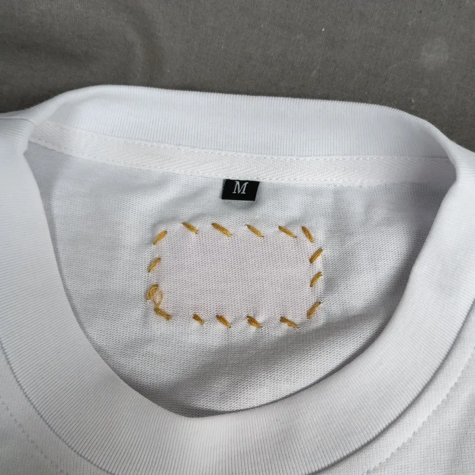 DIRTBAG WHITE T-SHIRT WITH MULTICOLOUR FOOTPRINT PRINT – SIZE M