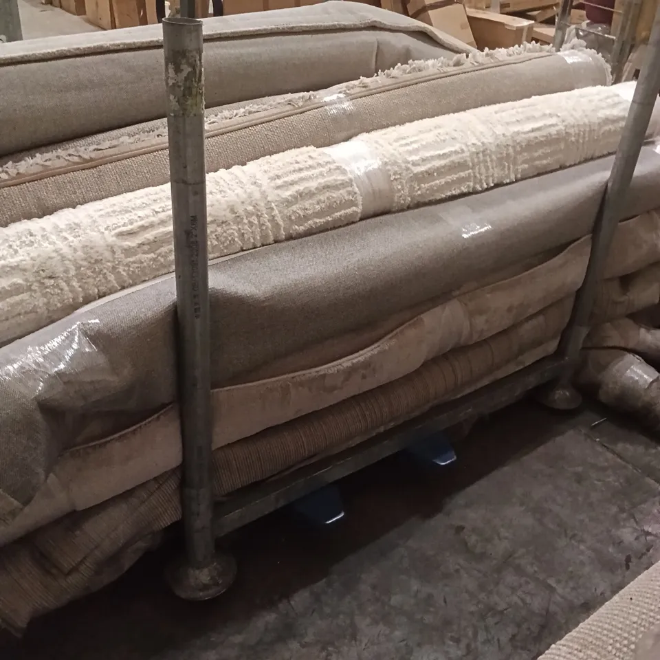 STILLAGE OF DESIGNER RUGS APPROXIMATELY 15 LARGE RUGS