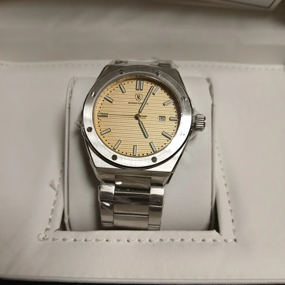 BERNARD REINHARDT WRISTWATCH – STAINLESS STEEL BRACELET, BEIGE DIAL, DATE