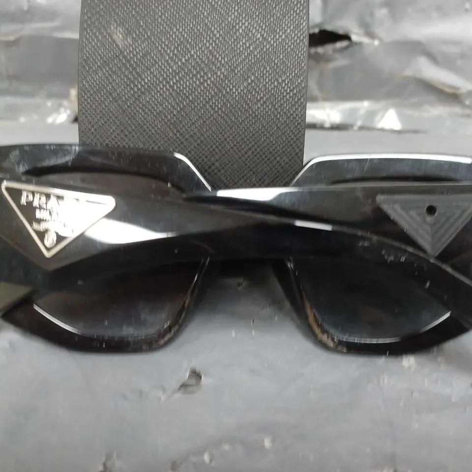 PRADA IRREGULAR SUNGLASSES IN BLACK