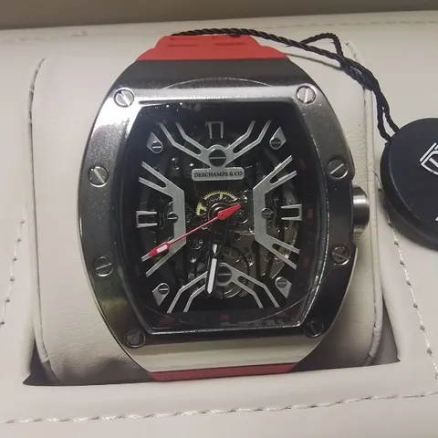 DESCHAMPS & CO STAINLESS STEEL SKELETON DIAL GENTS WATCH WITH AUTOMATIC MOVEMENT AND RED RUBBER STRAP IN WOODEN GIFT BOX