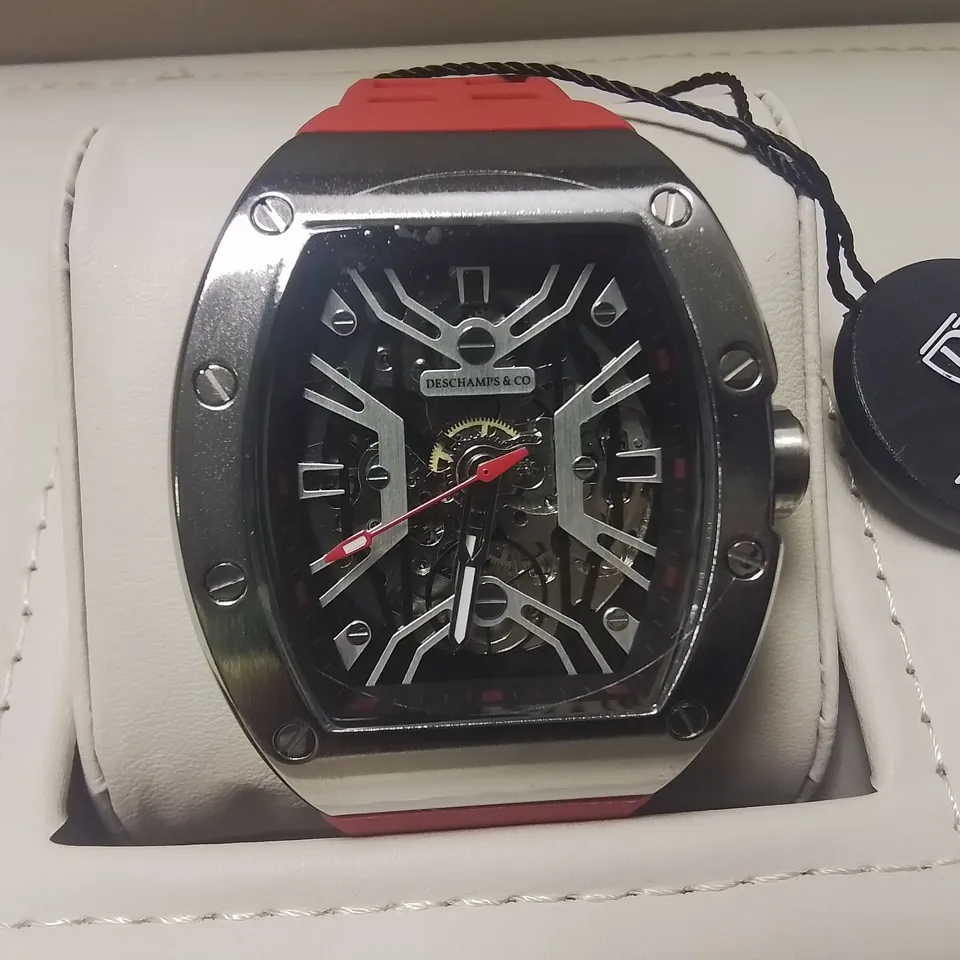 DESCHAMPS & CO STAINLESS STEEL SKELETON DIAL GENTS WATCH WITH AUTOMATIC MOVEMENT AND RED RUBBER STRAP IN WOODEN GIFT BOX