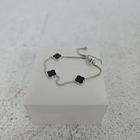 WARREN JAMES SILVER-TONE BRACELET WITH BLACK ENAMEL FOUR-LEAF CLOVER CHARMS