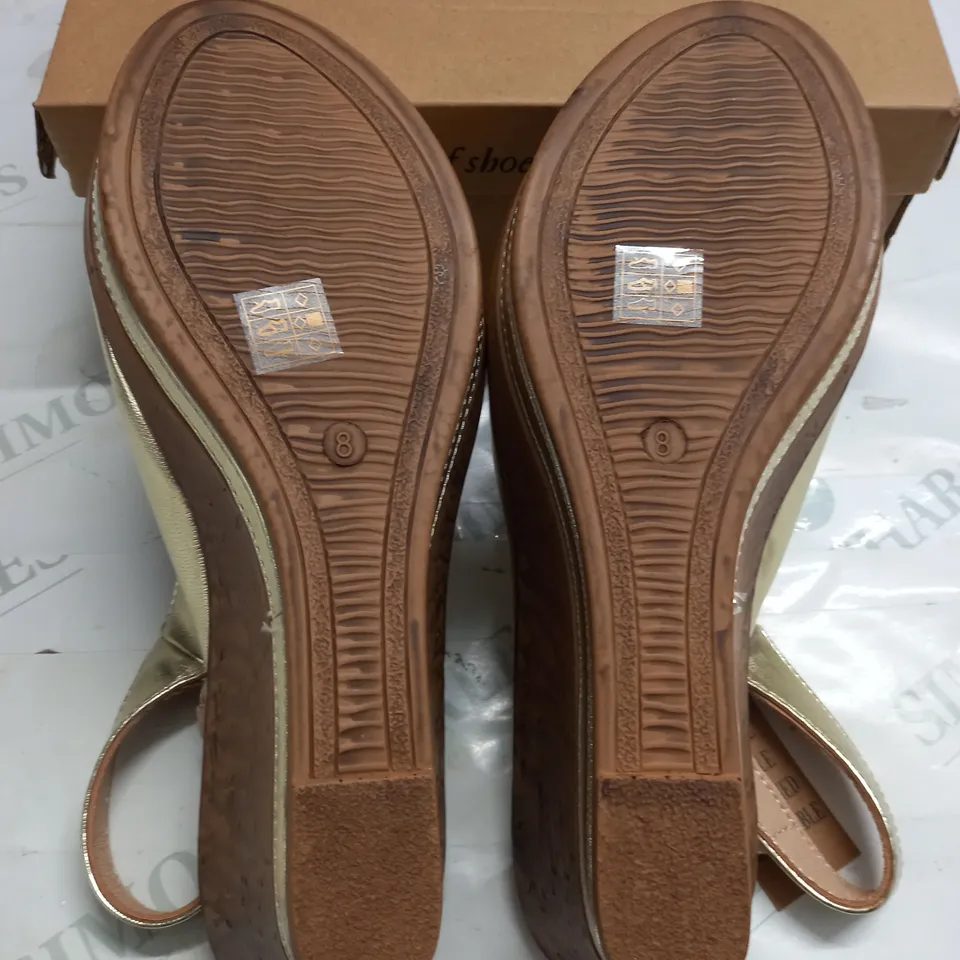 BOXED PAIR OF CUSHION WALK GOLD WEDGE HEELED SHOES - 8