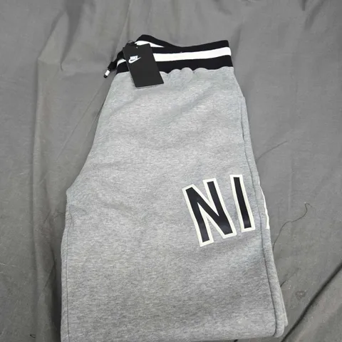 NIKE FLEECED TRACKSUIT BOTTOMS SIZE L