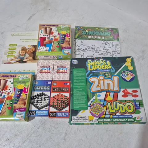 large quantity of assorted party games and activities to include snake & ladders, naughty card game and lcd writing tablets