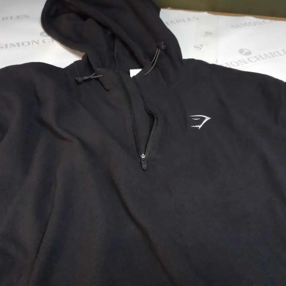 GYMSHARK HALF ZIP LONG SLEEVE HOODED EMBROIDED LOGO FLEECE IN BLACK - MEDIUM