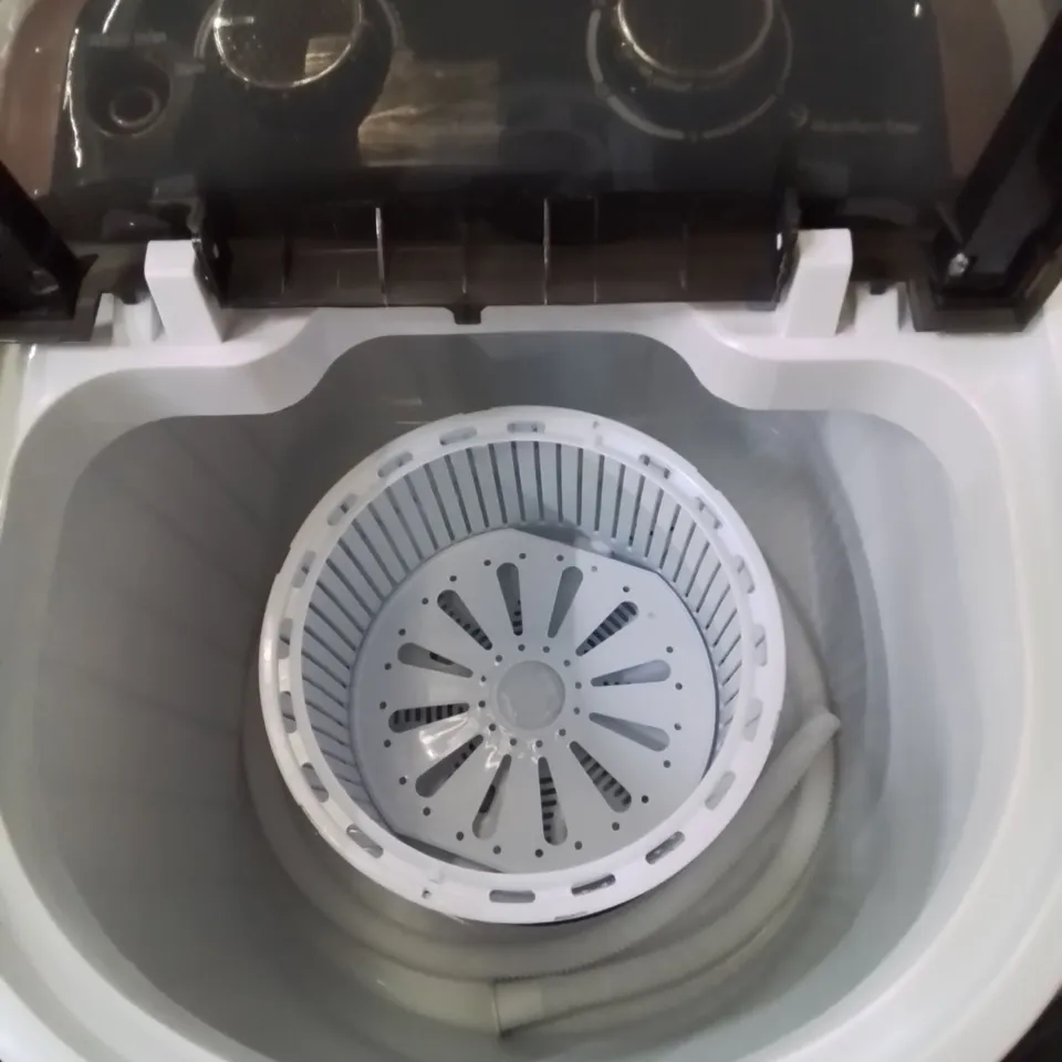 A BOXED COUNTER TOP MINI WASHING MACHINE 