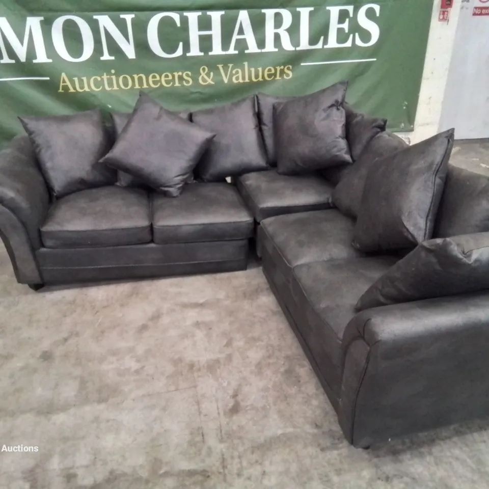 DESIGNER LEATHER LOOK FABRIC UPHOLSTERED CORNER SOFA IN BLACK HEAVILY DAMAGED AT REAR OF FRAME