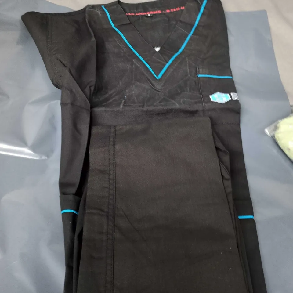 RANDOM ASSORTED BOX OF CLOTHING WOMEN/MENS/KIDS SIZES VARY: BLACK V-NECK TOP WITH TURQUOISE TRIM, BEIGE TROUSERS & PACKAGED GREEN FLORAL GARMENT (3 ITEMS)