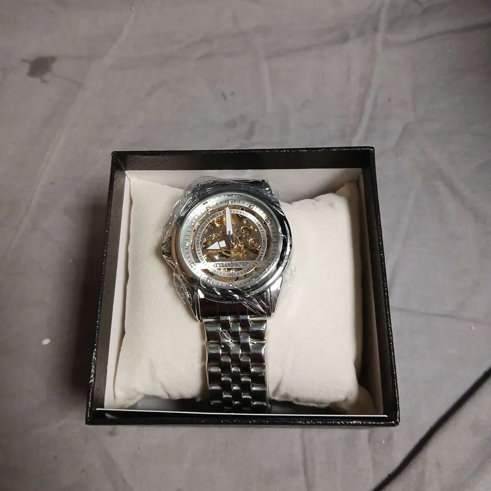 BOXED GLOBENFIELD EXHIBITION DIAL GENTS WATCH WITH SKELETON BACK CASE AND METAL STRAP