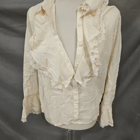 THE HIPPIE SHAKE STORYTELLER LACE TRIM RUFFLE BLOUSE IN CREAM SIZE 10