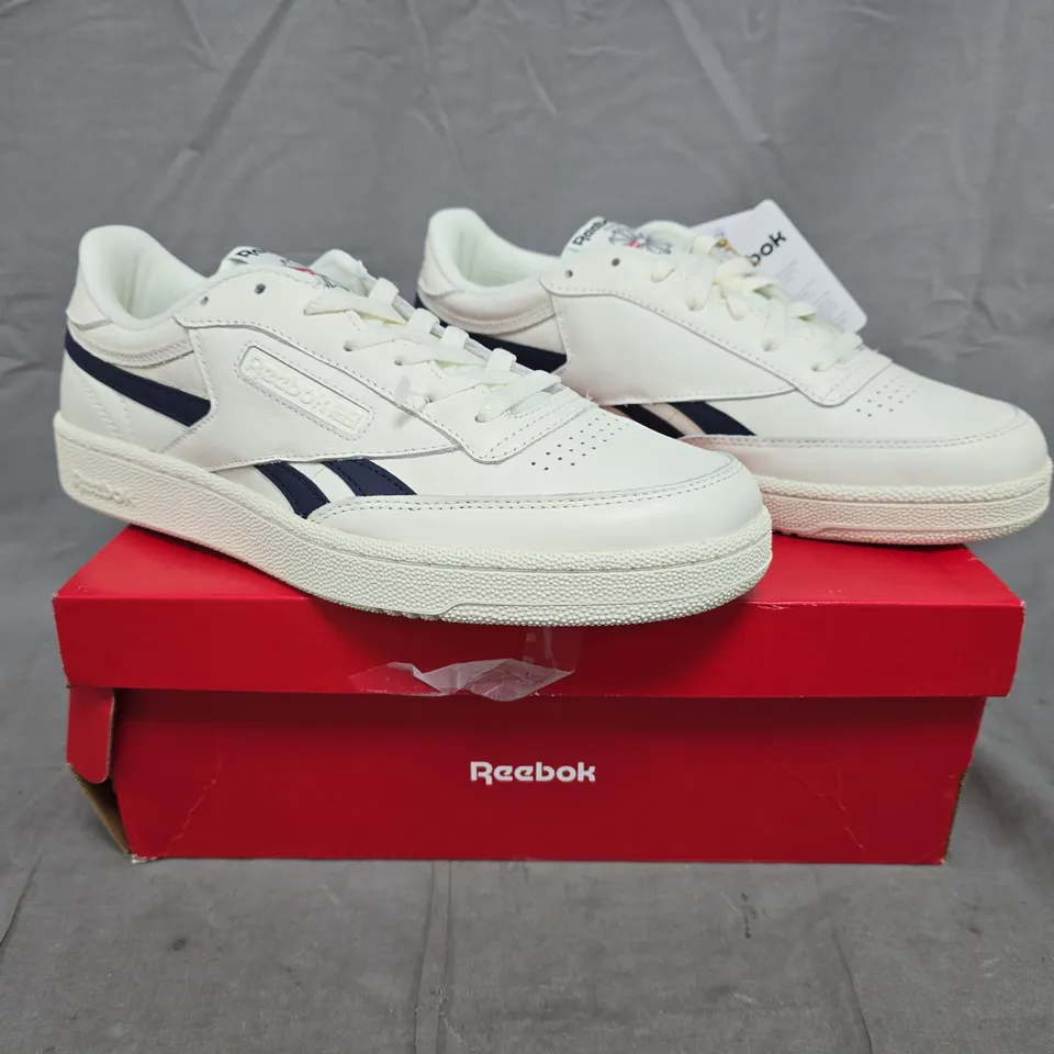 BOXED PAIR OF REEBOK CLUB C REVENGE TRAINERS IN OFF-WHITE/NAVY SIZE UK 10.5