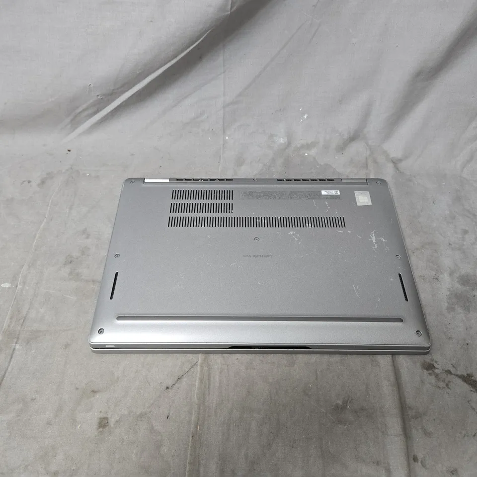 DELL LAPTOP – INTEL CORE I5, SILVER WITH POWER PACK. POWERS ON. MULTIPLE KEYS MISSING