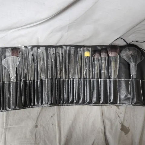MAKEUP BRUSH SET IN BLACK LEATHER ROLL CASE, BOX OF APPROXIMATELY 10