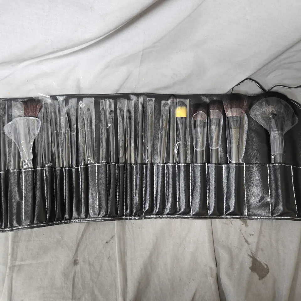MAKEUP BRUSH SET IN BLACK LEATHER ROLL CASE, BOX OF APPROXIMATELY 10