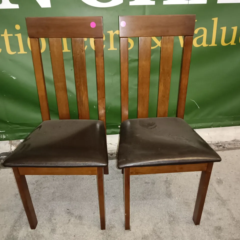 PAIR OF WOODEN DINING CHAIRS WITH BLACK FAUX LEATHER SEAT PADS 