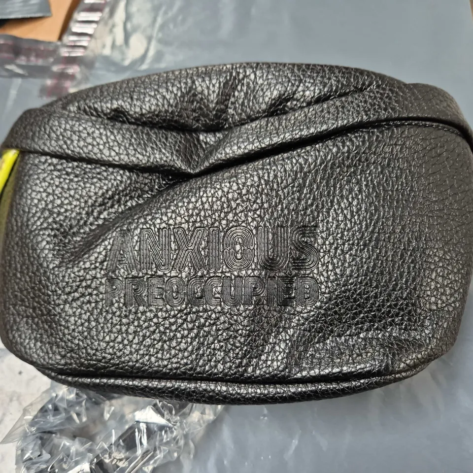 ANXIOUS PREOCCUPIED BLACK PEBBLE-TEXTURE ZIPPERED POUCH WITH EMBOSSED LETTERING