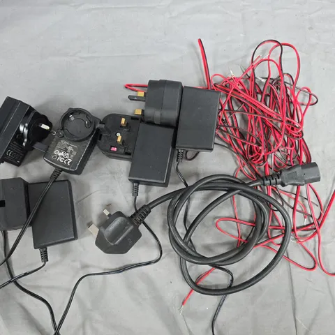 LARGE QUANTITY OF ASSORTED CABLES TO INCLUDE POWER SUPPLIES, SPEAKER CABLE AND KETTLE LEAD