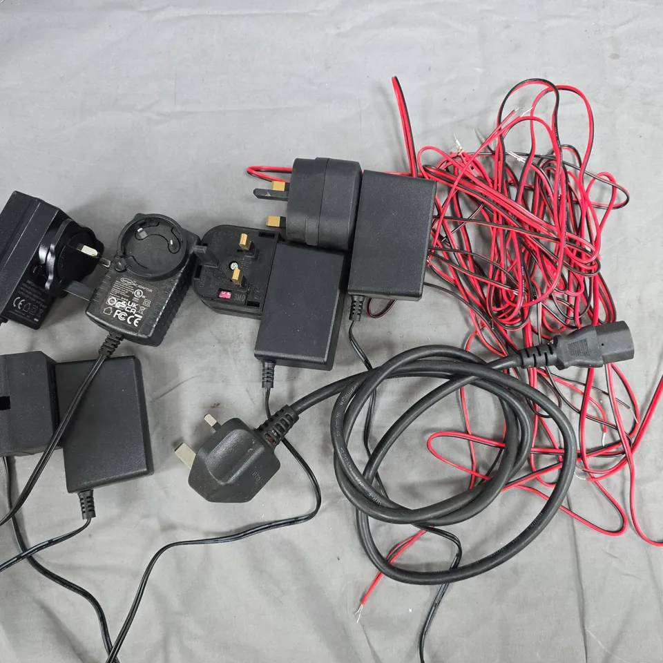 LARGE QUANTITY OF ASSORTED CABLES TO INCLUDE POWER SUPPLIES, SPEAKER CABLE AND KETTLE LEAD