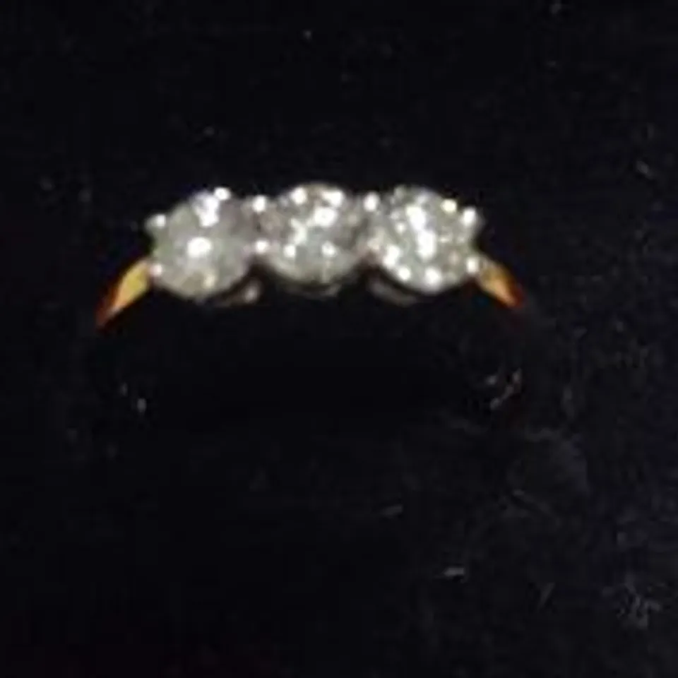 18CT GOLD THREE STONE RING SET WITH NATURAL DIAMONDS