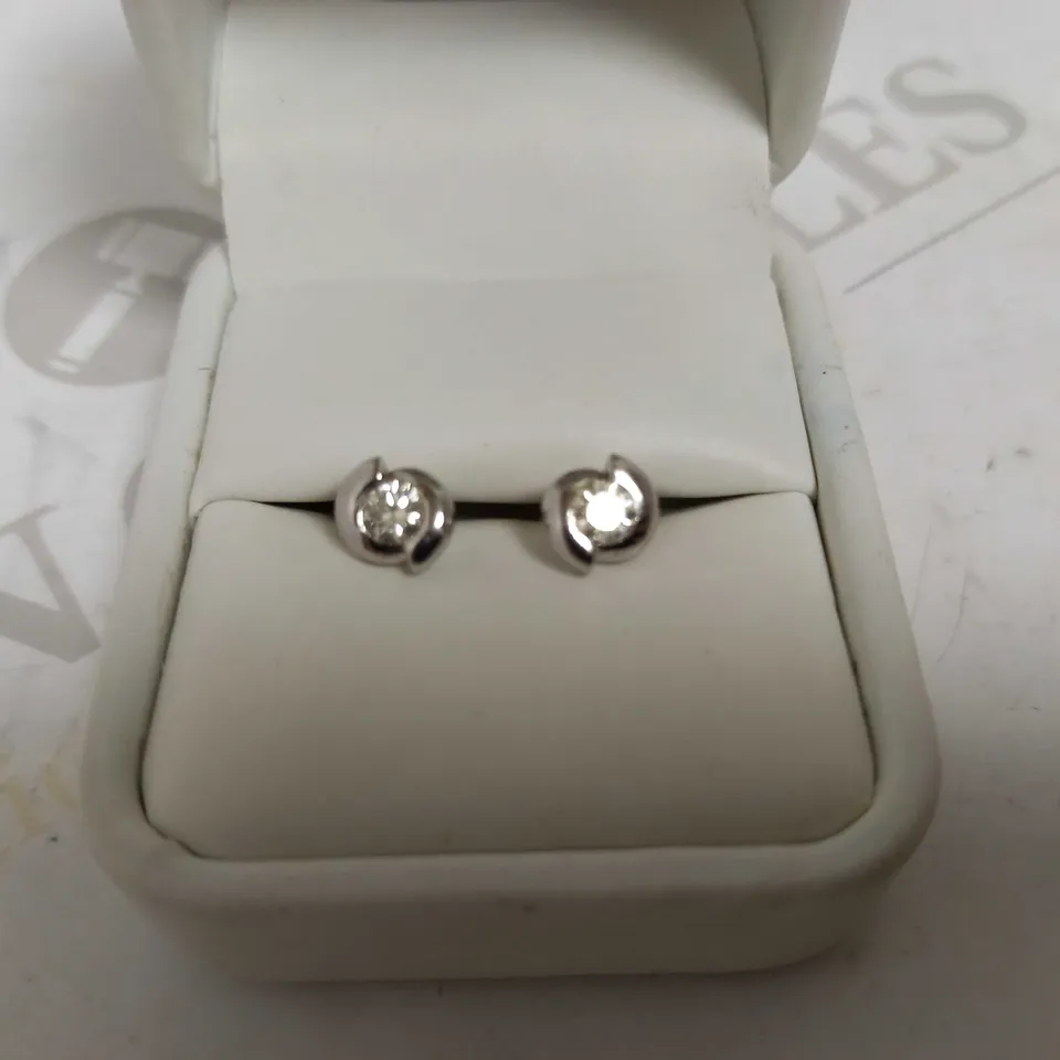 DESIGNER 18CT WHITE GOLD STUD EARRINGS SET WITH DIAMONDS WEIGHING +-0.52CT