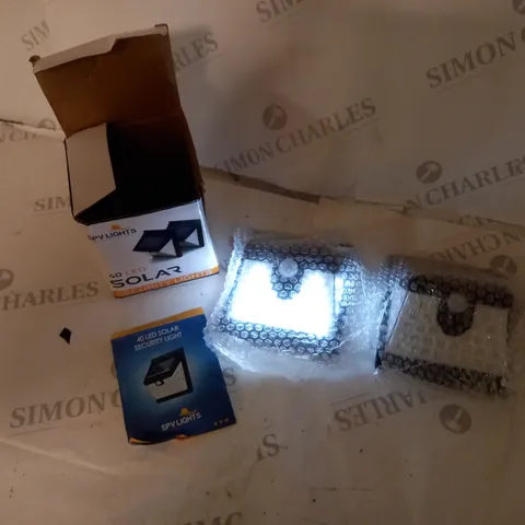 BOXED SET OF TWO LED SOLAR SECURITY LIGHTS WITH INSTRUCTIONS AND FITTINGS