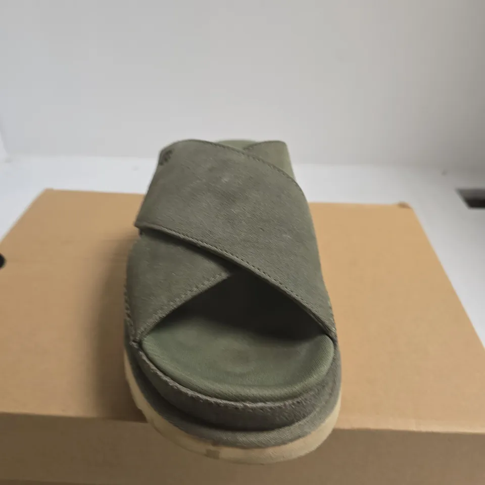 BOXED PAIR OF WOMENS UGG GOLDENSTAR CROSS SLIDE – OLIVE GREEN, UK 7 (EU 40)
