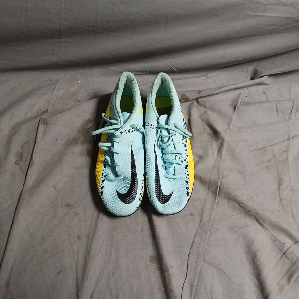 NIKE FOOTBALL BOOTS – LIGHT BLUE WITH BLACK SWOOSH AND YELLOW ACCENTS