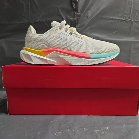 BOXED PAIR OF NEW BALANCE FUELCELL TRAINERS IN WHITE/MULTI SIZE UK 7.5