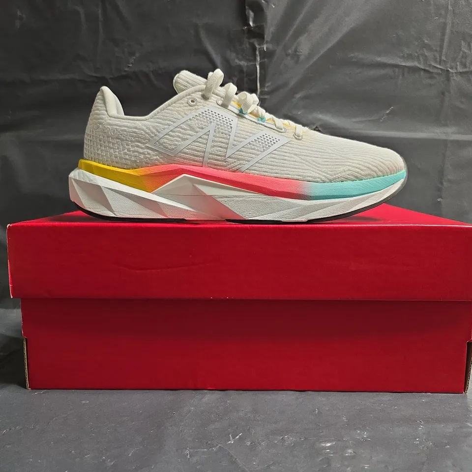 BOXED PAIR OF NEW BALANCE FUELCELL TRAINERS IN WHITE/MULTI SIZE UK 7.5