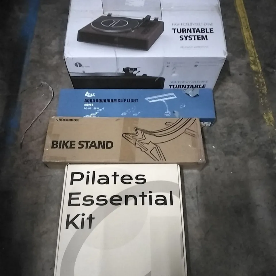 PALLET OF HOUSEHOLD ITEMS TO INCLUDE TURNTABLE SYSTEM, AQUARIUM CLIP LIGHT, BIKE STAND, PILATES KIT AND OTHER ASSORTED ITEMS...