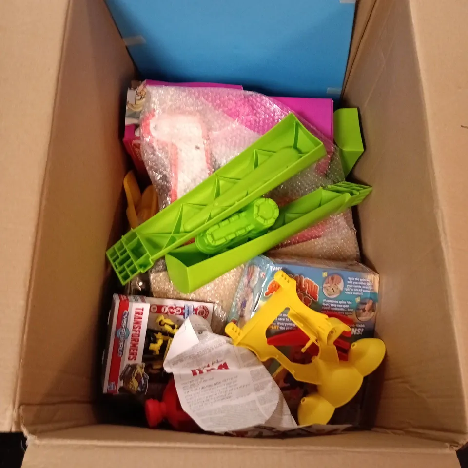 Assorted children's toys and craft items in a box