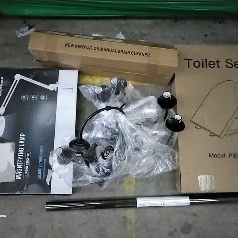 PALLET OF ASSORTED ITEMS INCLUDING TOILET SEAT, WINDOW FILM, MANUAL DRAIN CLEANER, CHANDELIER LIGHT FIXTURE, MAGNIFYING LAMP, ECO SET PAELLE PAN