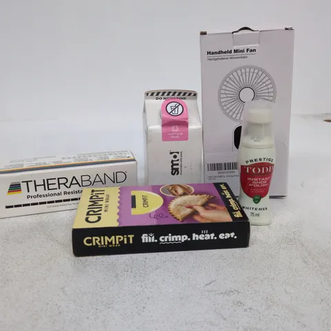 TOTE OF APPROXIMATELY 15 ASSORTED ITEMS TO INCLUDE HANDHELD MINI FAN, SHOE POLISH, CRIMPIT MINI WRAP, THERABAND ETC