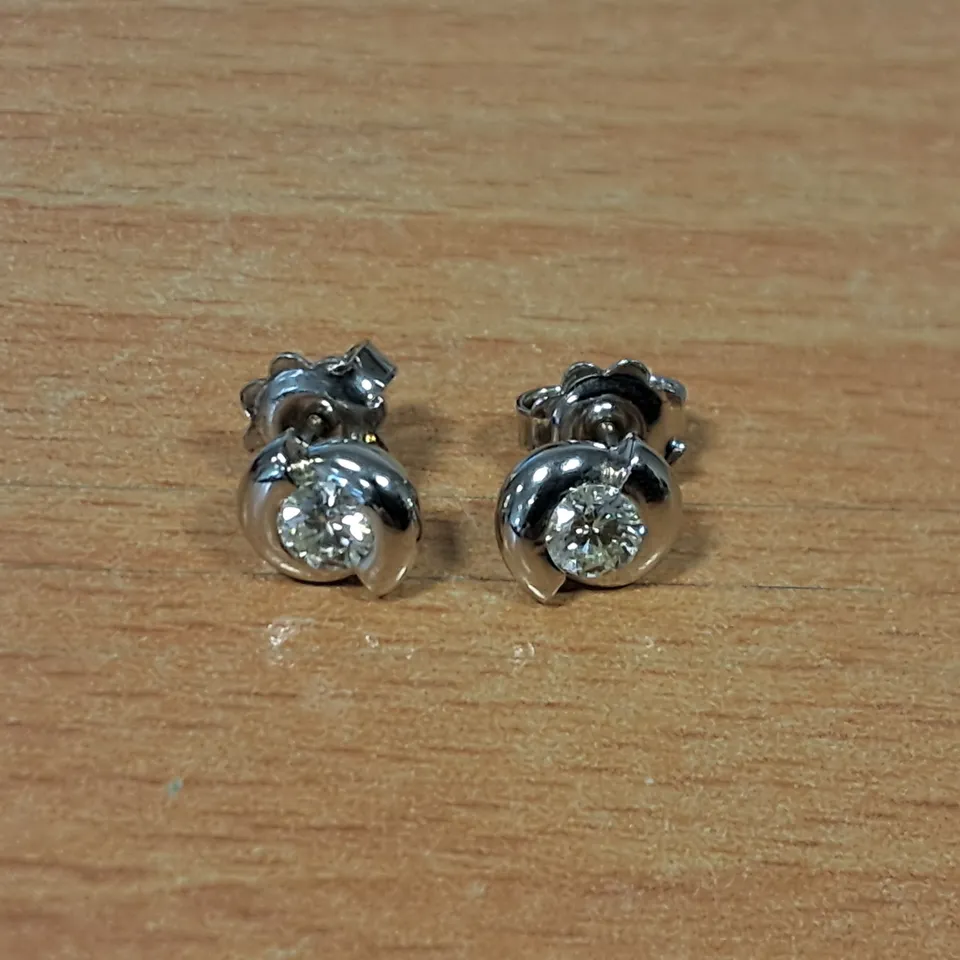 18CT WHITE GOLD TWIST EARRINGS SET WITH NATURAL DIAMONDS